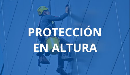 Trabajador de altura descolgado reparando fachada con casco y cubo amarillo